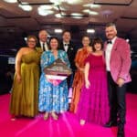 Celebrating Business of the Year on stage at the BEA's 2024