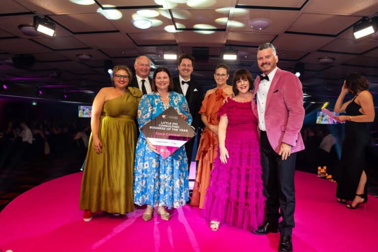 Celebrating Business of the Year on stage at the BEA's 2024
